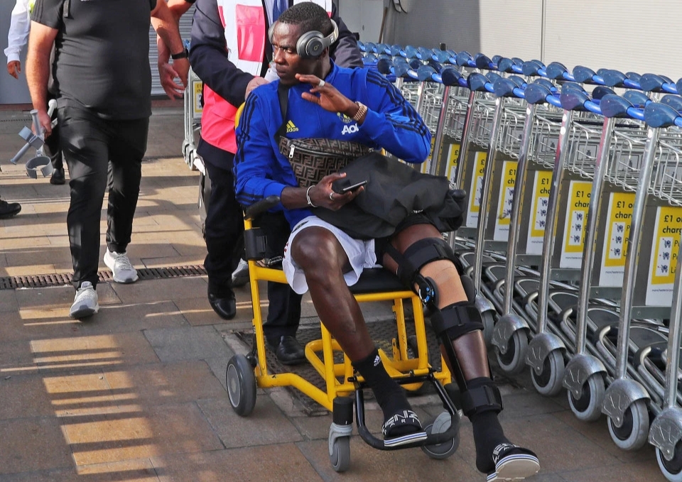 Eric Bailly returns home in a wheelchair as Solskjaer’s squad arrive home from pre-season